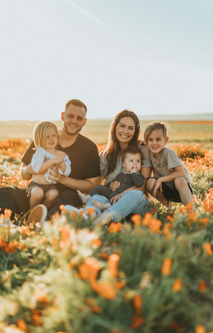 family photo in a field of orange flowers